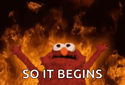 Elmo Standing Before Fire So It Begins GIF