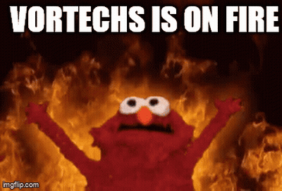 Elmo Standing In Front Of Fire Saying Vortechs Is On Fire GIF