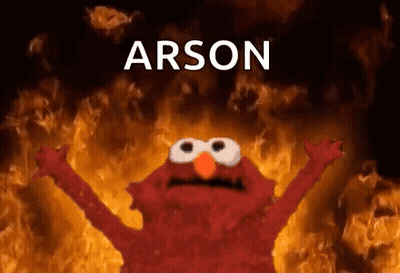 Elmo Standing In Front Of Fire With Arson GIF
