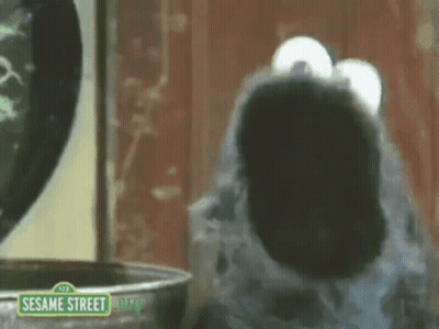 Elmo Standing In Front Of Trash Can GIF