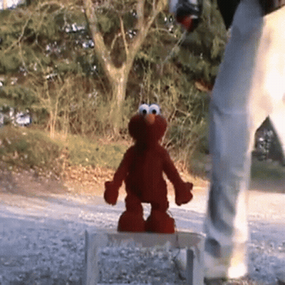 Elmo Standing On Wooden Stool GIF