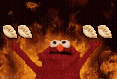 Elmo Surrounded By Flames Holding Dumplings GIF