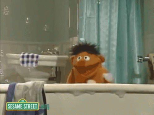 Elmo Taking a Bath in a Tub