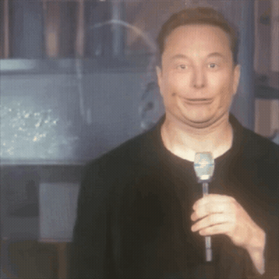 Elon Musk Is Holding A Microphone And Making A Face GIF