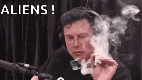 Elon Musk Is Smoking A Marijuana Joint In Front Of A Microphone While Wearing Headphones . GIF