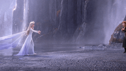 Elsa And Anna From Frozen Are Standing Next To Each Other GIF