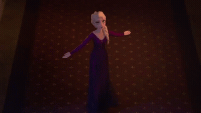 Elsa From Frozen Standing On Red Carpet With Arms Outstretched GIF
