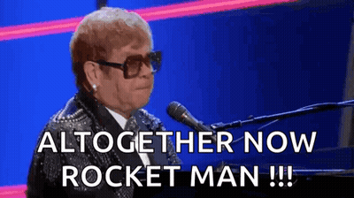 Elton John Singing Into Microphone With Sunglasses GIF