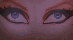 Elvira Making Her Way Through A Poster GIF