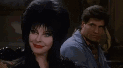 Elvira Sitting Next To Bob Redding GIF