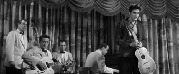 Elvis Destroying Guitar Off Stage Film Clip GIF