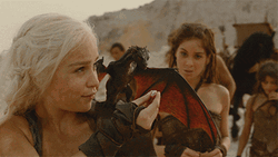 Emilia Clarke As Khaleesi Feeding Dragon GIF