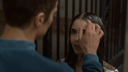 Emily In Paris Gabriel Fixing Emily's Hair GIF