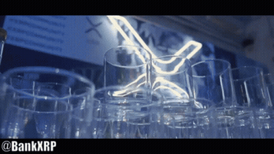 Empty Glasses Lined Up In Front Of Neon Sign GIF