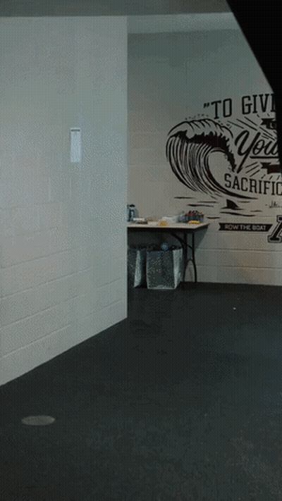 Empty Room With Sign Saying To Give You Sacrifice GIF