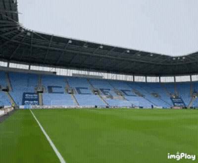 Empty Soccer Stadium With Coca-Cola On Stands GIF