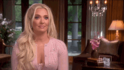 Erika Jayne Nonchalant Shoulder Brush GIF