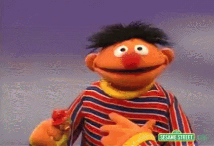 Ernie From Sesame Street In Striped Shirt Holding Banana GIF