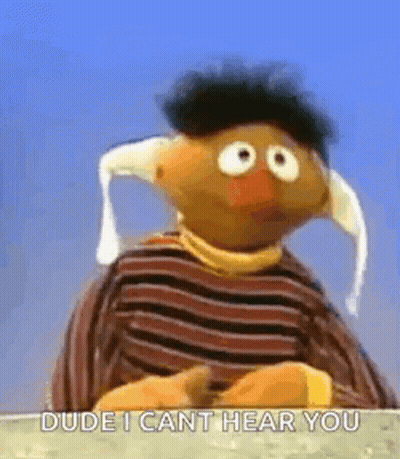 Ernie From Sesame Street Is Wearing A Striped Shirt And A Hat And Says `` Dude I Can T Hear You '' . GIF
