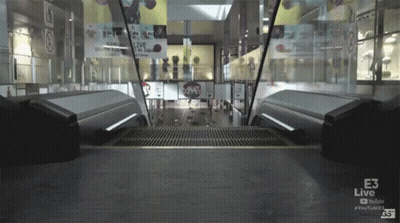Escalator In Mall With E3 Live Sign GIF