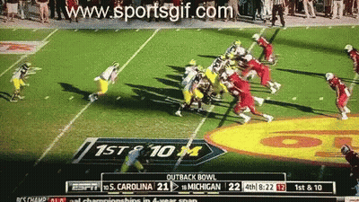 Espn Is Showing A Football Game Between Michigan And South Carolina GIF
