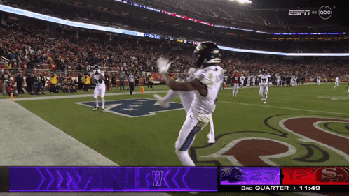 Espn Is Showing A Football Game Between The San Francisco 49Ers And New England Patriots GIF