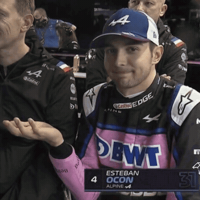 Esteban Ocon In Pink And Blue Alpine Outfit GIF