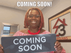 Excited Lady Showing Coming Soon Sign GIF