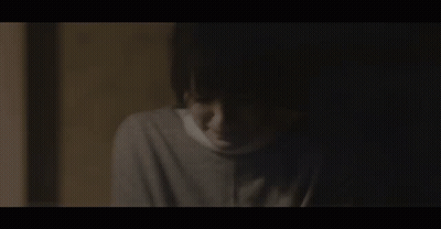 Face With Bandage In Dark GIF