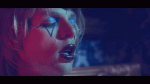 Face With Red And Blue Light Behind GIF
