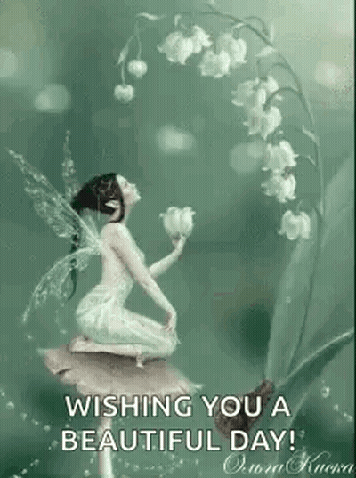 Fairy Sitting On Mushroom With Lily Of The Valley GIF