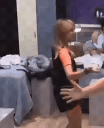 Family In Front Of House With Wife Swap Sign GIF