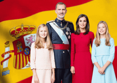 Family Posing in Front of Spanish Flag