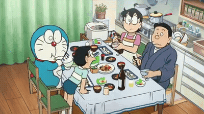 Family Sitting Around Table With Doraemon GIF