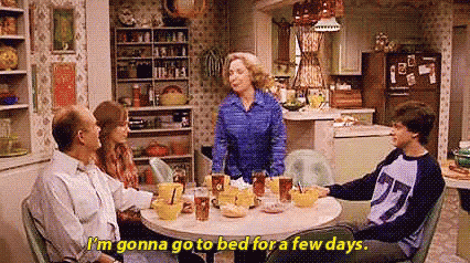 Family Sitting At Kitchen Table GIF