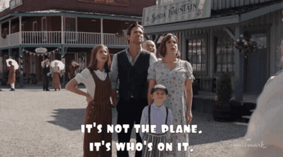Family Standing In Front Of Soda Fountain GIF