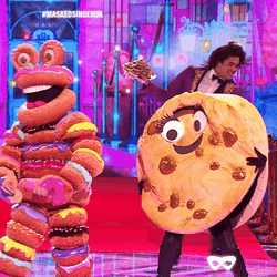 Famous Amos Cookie Mascot Dancing On Stage GIF