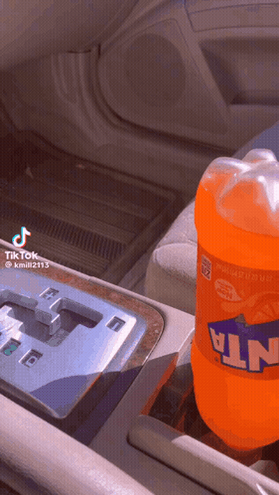 Fanta Bottle In Car Console GIF
