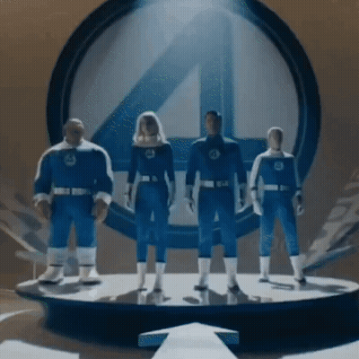 Fantastic Four Figures Standing in Front of Logo