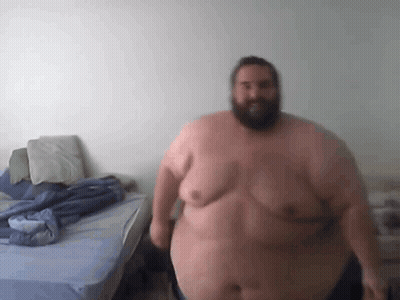 Fat Bearded Man Beside Bed GIF
