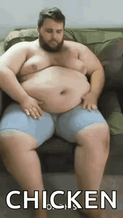 Fat Bearded Man Sitting On Couch GIF