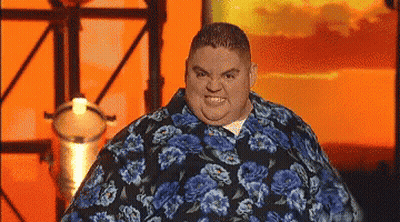 Fat Man In Blue Floral Shirt Making Funny Face GIF