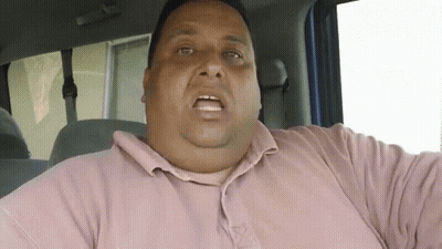 Fat Man In Pink Shirt Sitting In Car GIF