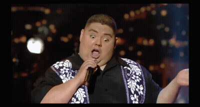 Fat Man Singing Into Microphone With Tongue Out GIF