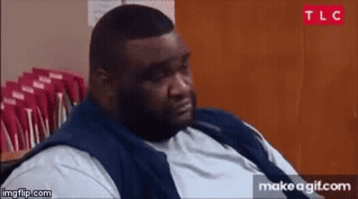 Fat Man Sitting In Front Of Red Envelopes GIF