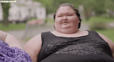 Fat Woman In Black Tank Top And Purple Shorts GIF