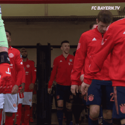 FC Bayern.Tv Soccer Players In Red Jackets Blue Shorts GIF