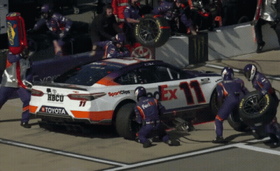 FedEx Race Car Worked On By Mechanics GIF