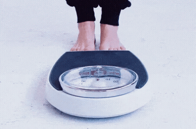 Feet On Scale With Number 10 GIF