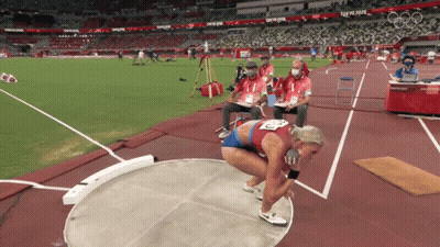 Female Athlete Throwing Discus At Tokyo 2020 Stadium GIF